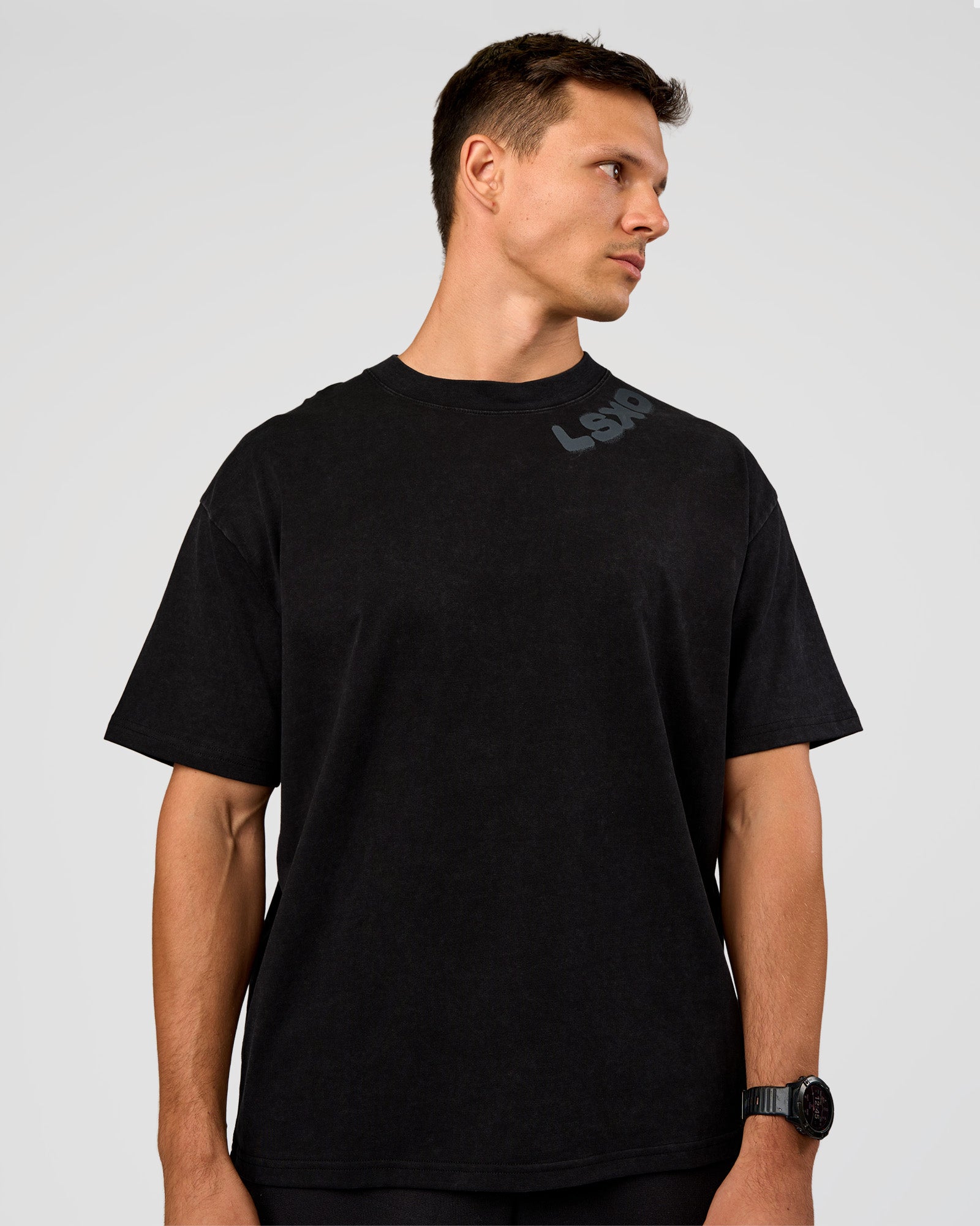 Man wearing Offset Heavyweight Unisex Oversized Tee - Black Washed-Castlerock | Model:Liam | Size:L