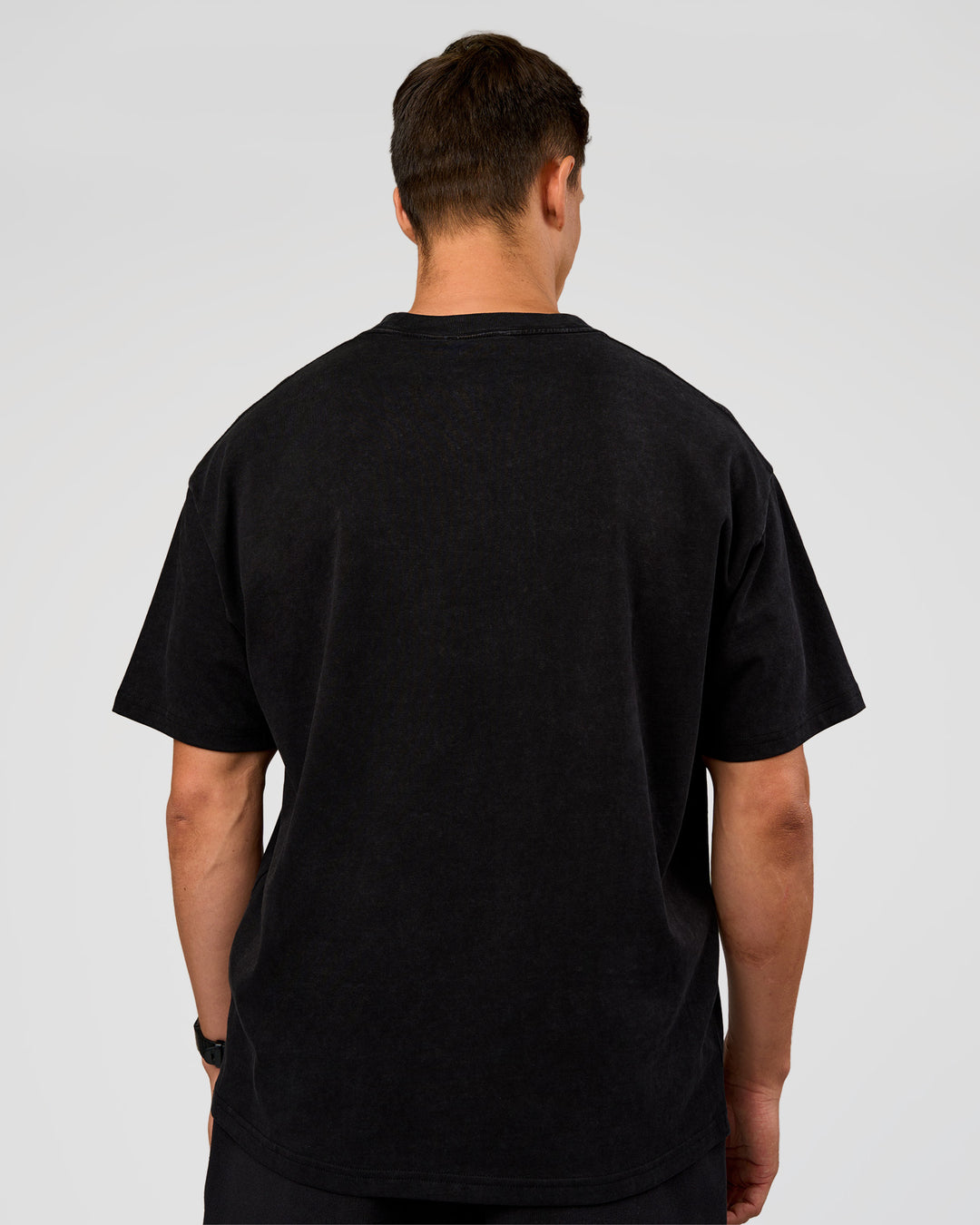 Man wearing Offset Heavyweight Unisex Oversized Tee - Black Washed-Castlerock | Model:Liam | Size:L