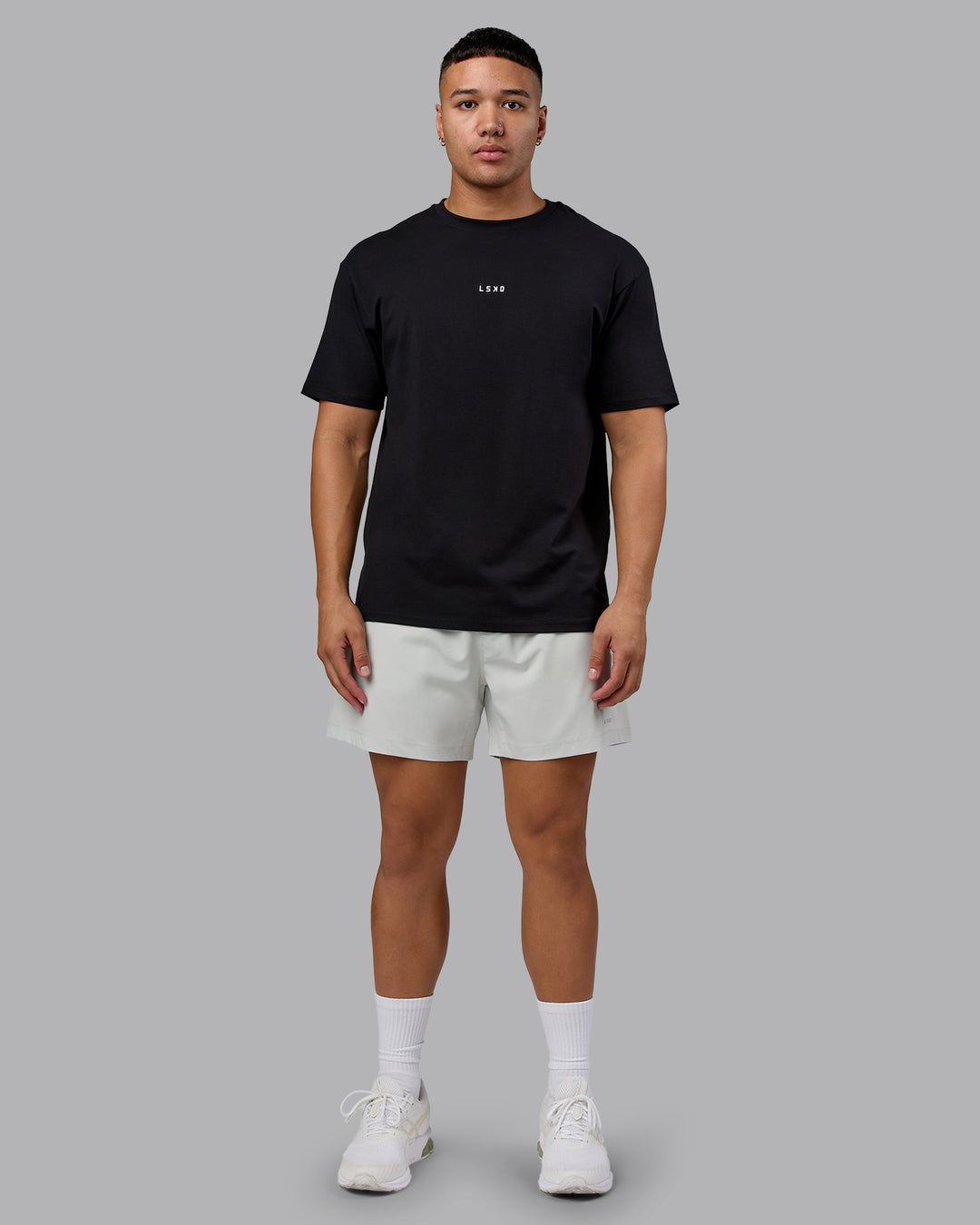 Man wearing On Repeat FLXCotton Oversized Tee - Black-White | Model:Kaelyb | Size:L