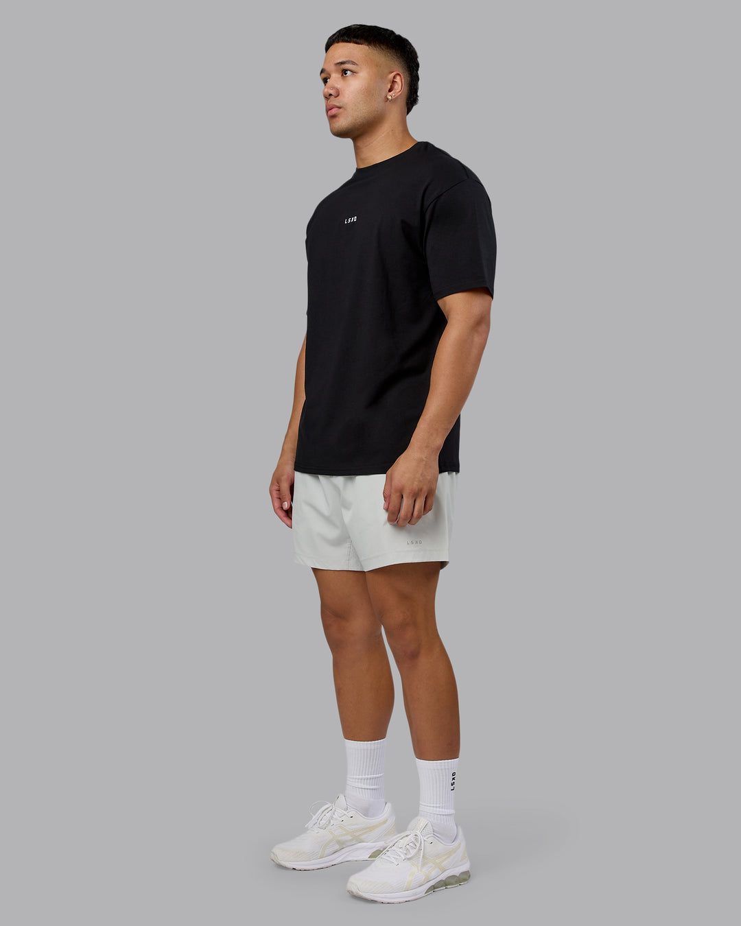 Man wearing On Repeat FLXCotton Oversized Tee - Black-White | Model:Kaelyb | Size:L