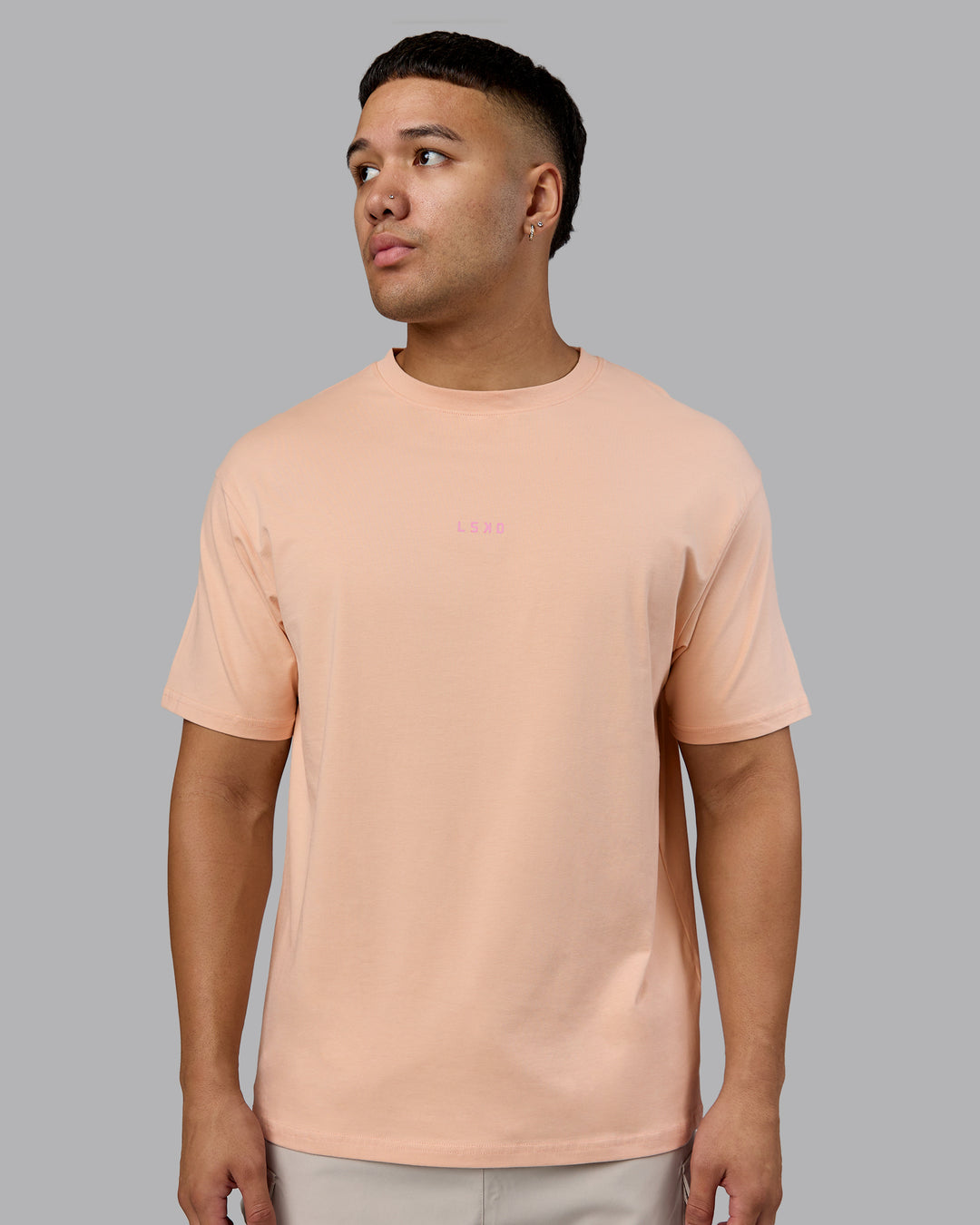 Man wearing On Repeat FLXCotton Oversized Tee - Cameo Rose-Candy Pink | Model:Kaelyb | Size:L
