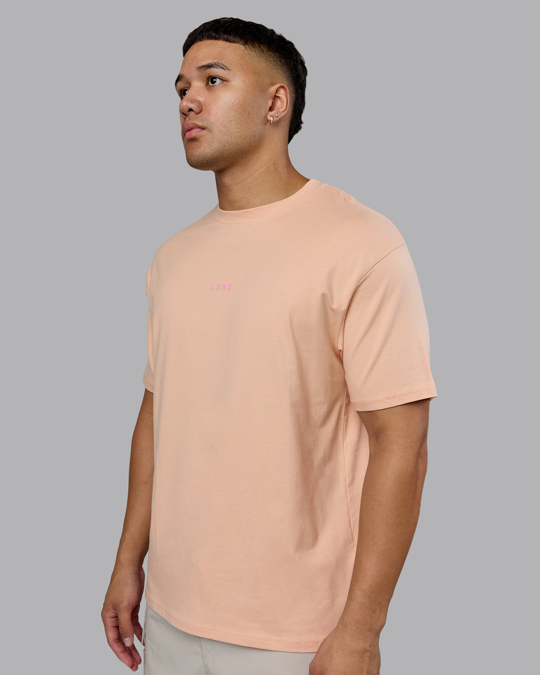 Man wearing On Repeat FLXCotton Oversized Tee - Cameo Rose-Candy Pink | Model:Kaelyb | Size:L