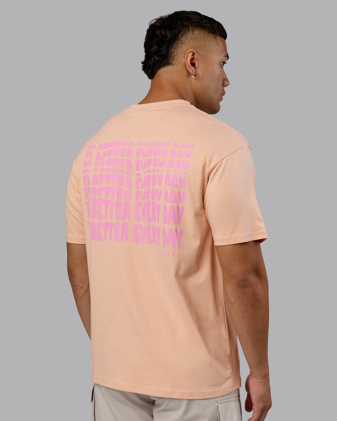Man wearing On Repeat FLXCotton Oversized Tee - Cameo Rose-Candy Pink | Model:Kaelyb | Size:L