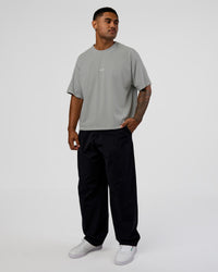 Man wearing Oversized Heavyweight Boxed Tee - Light Grey Marl | Model:Xav | Size:L