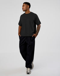 Man wearing Oversized Heavyweight Boxed Tee - Washed Black | Model:Xav | Size:L