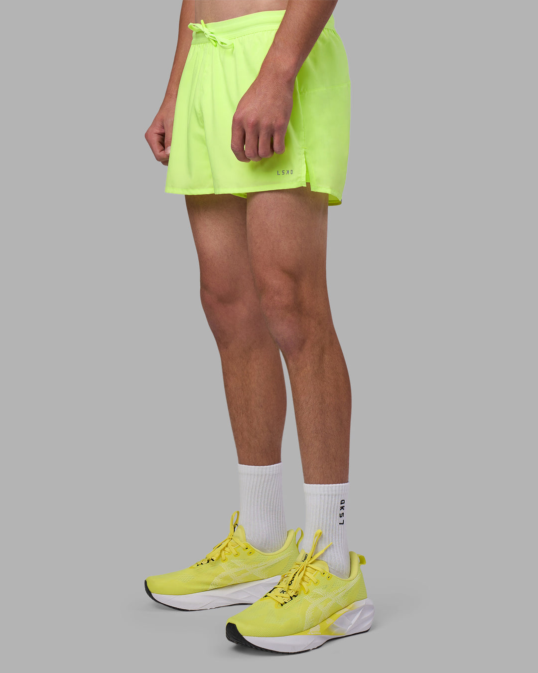 Man wearing Pace 3&quot; Performance Short - Lime Glo | Model:Brandon | Size:L