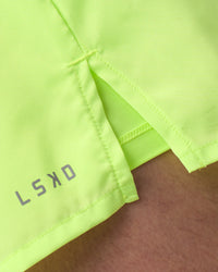 Man wearing Pace 3" Performance Short - Lime Glo | Model:Brandon | Size:L