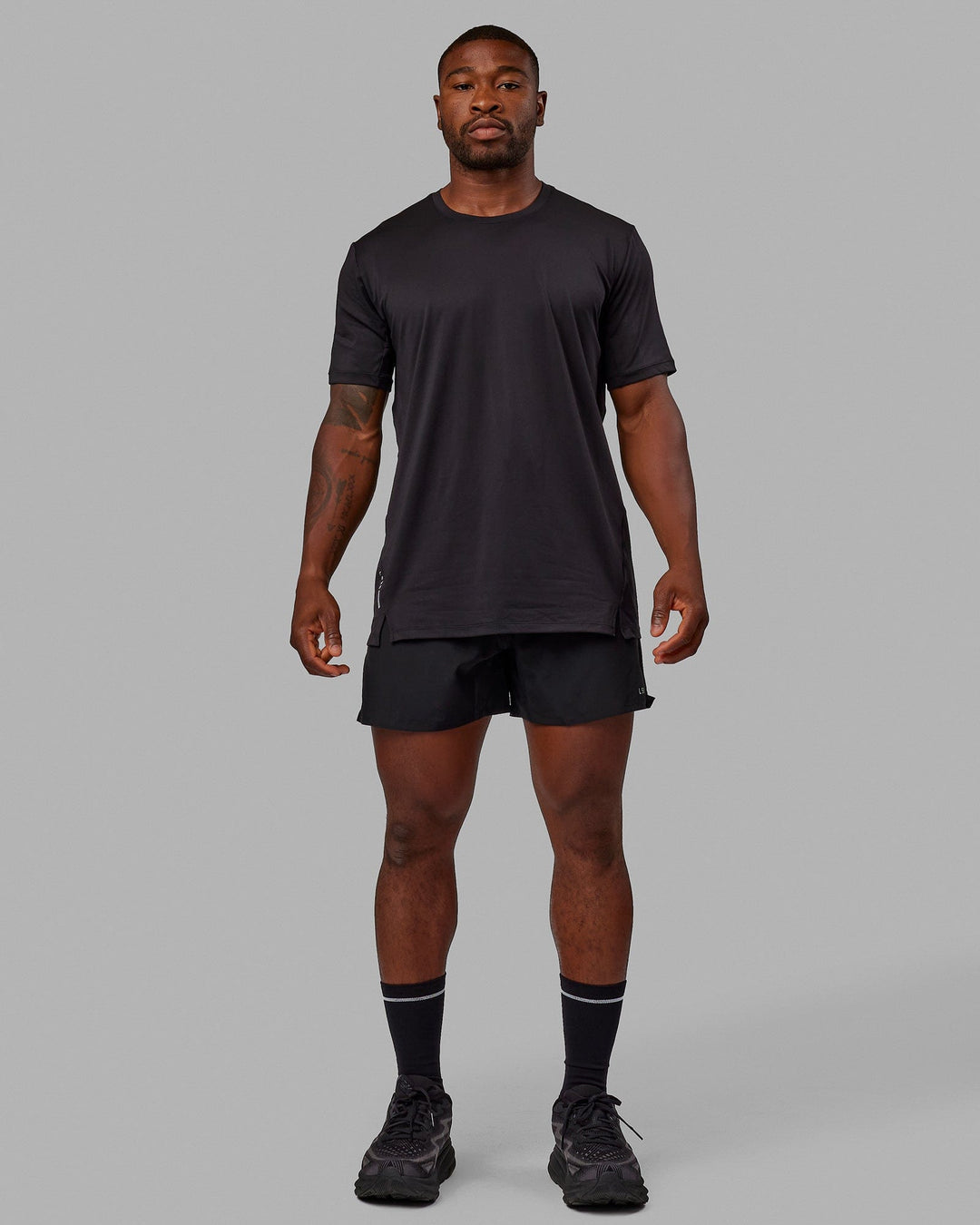 Man wearing Pace 5&quot; Lined Performance Shorts - Black-Reflective
