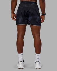 Man wearing Pace 5" Lined Performance Short - Washed Black | Model:Sam | Size:L