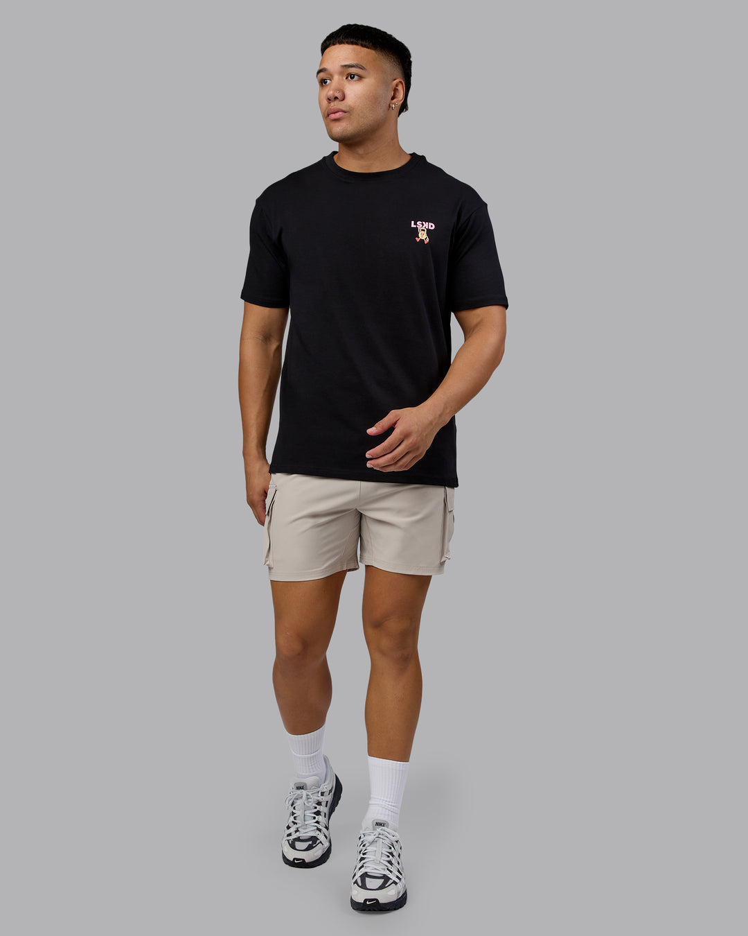 Man wearing Perspective FLXCotton Oversized Tee - Black-Soft Pink | Model:Kaelyb | Size:L