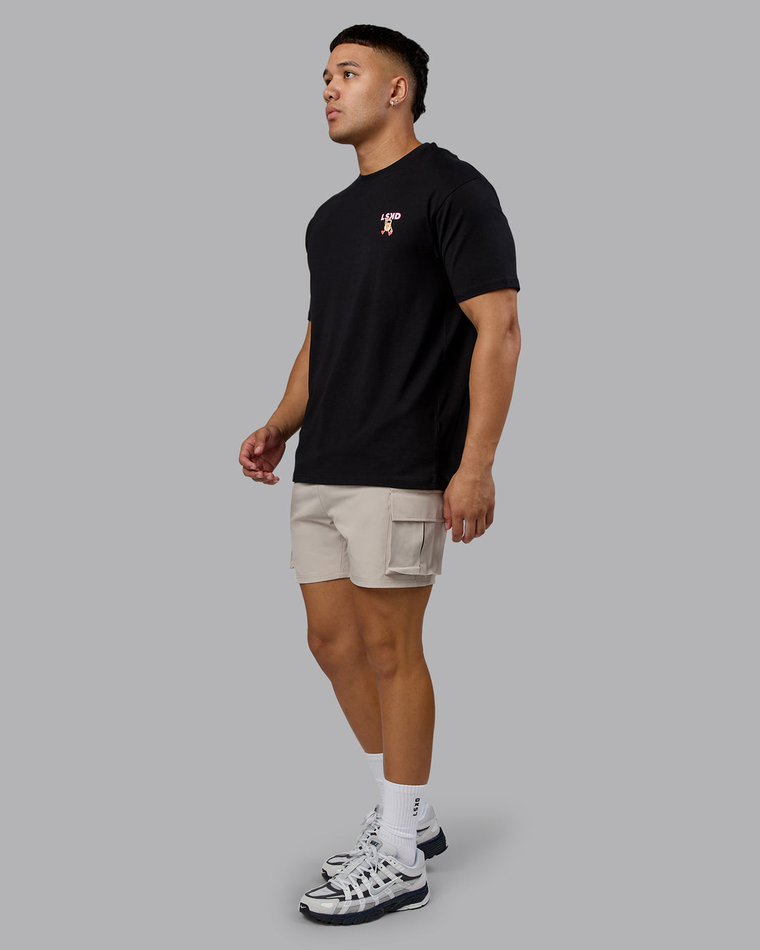 Man wearing Perspective FLXCotton Oversized Tee - Black-Soft Pink | Model:Kaelyb | Size:L