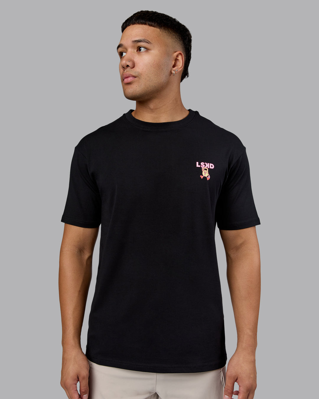 Man wearing Perspective FLXCotton Oversized Tee - Black-Soft Pink | Model:Kaelyb | Size:L