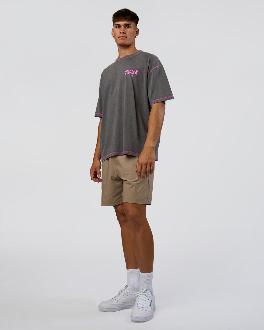 Man wearing Pressure is Privilege Oversized Tee - Dark Storm Washed-Ultra Fuchsia | Model:Jackson | Size:L