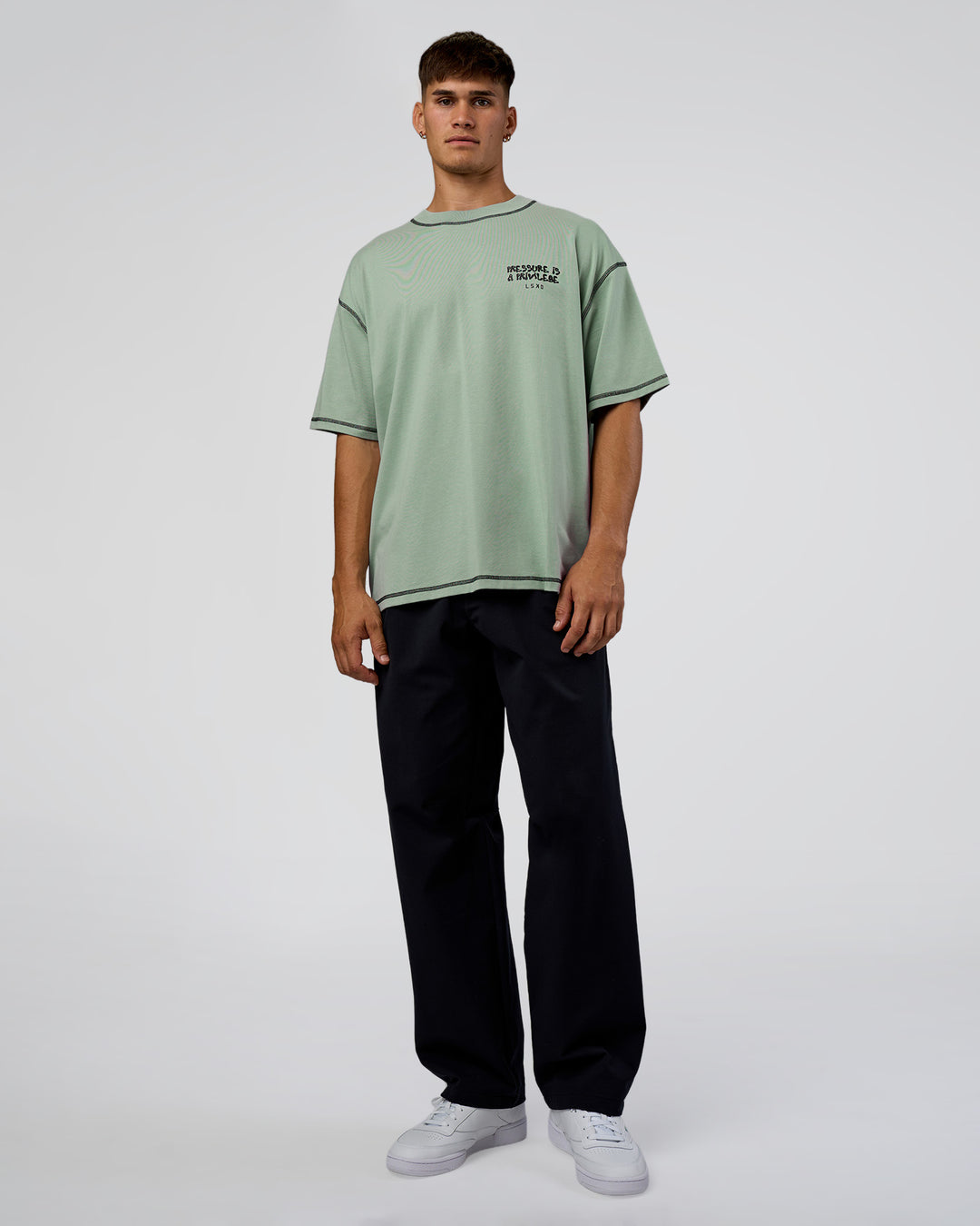 Man wearing Pressure is Privilege Oversized Tee - Iceberg Green-Black | Model:Jackson | Size:L