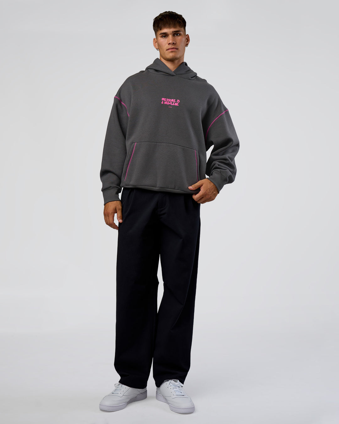 Man wearing Pressure is Privilege Oversized Hoodie - Dark Storm-Ultra Fuchsia | Model:Jackson | Size:L