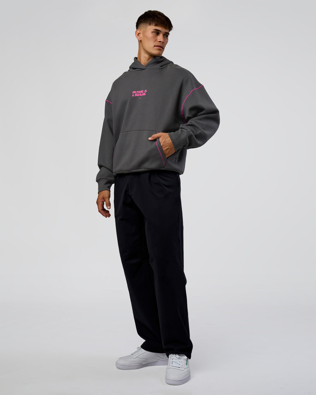 Man wearing Pressure is Privilege Oversized Hoodie - Dark Storm-Ultra Fuchsia | Model:Jackson | Size:L