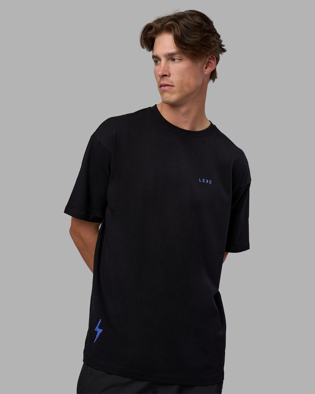 Man wearing Pressure is a Privilege FLXCotton Oversized Tee - Black-Power Cobalt | Model:Brandon | Size:L