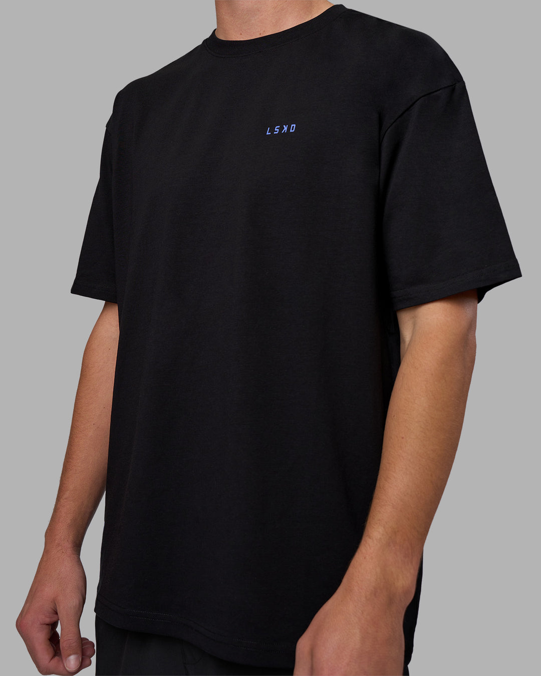 Man wearing Pressure is a Privilege FLXCotton Oversized Tee - Black-Power Cobalt | Model:Brandon | Size:L