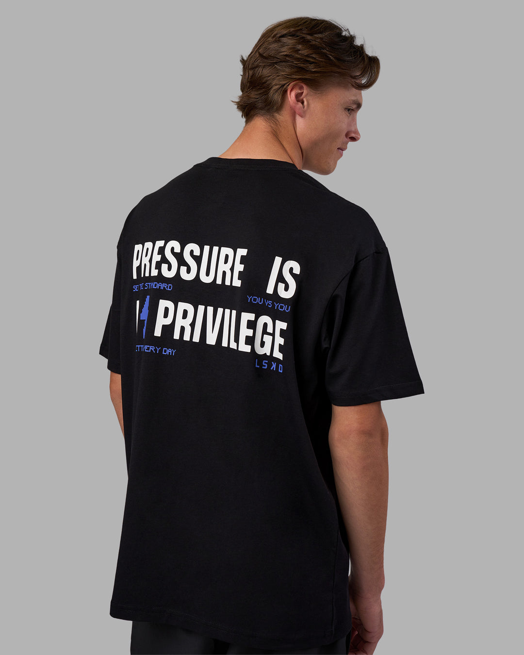 Man wearing Pressure is a Privilege FLXCotton Oversized Tee - Black-Power Cobalt | Model:Brandon | Size:L