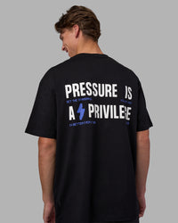 Man wearing Pressure is a Privilege FLXCotton Oversized Tee - Black-Power Cobalt | Model:Brandon | Size:L