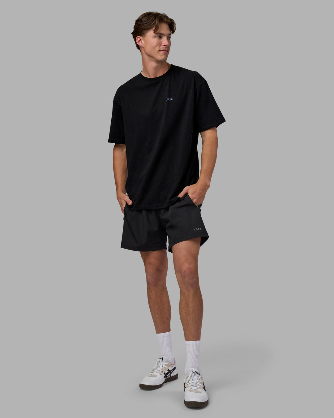 Man wearing Pressure is a Privilege FLXCotton Oversized Tee - Black-Power Cobalt | Model:Brandon | Size:L