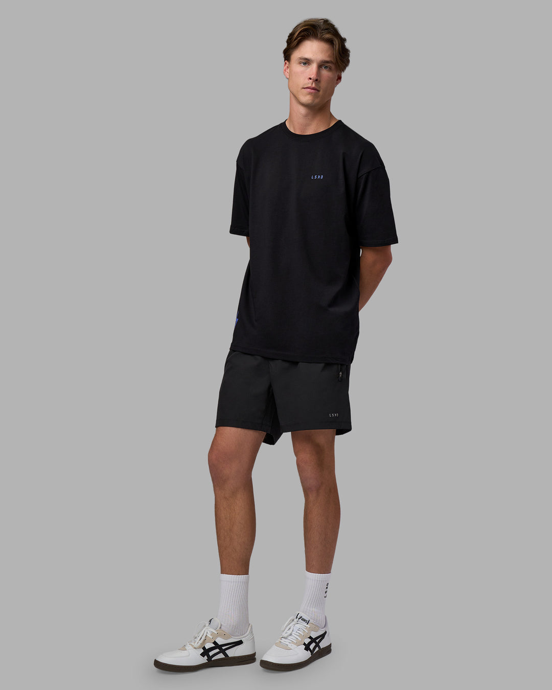 Man wearing Pressure is a Privilege FLXCotton Oversized Tee - Black-Power Cobalt | Model:Brandon | Size:L