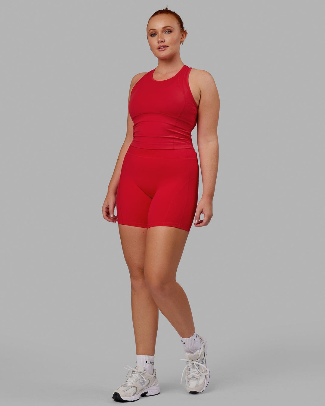 Woman wearing Propel Performance Tank - Scarlet
