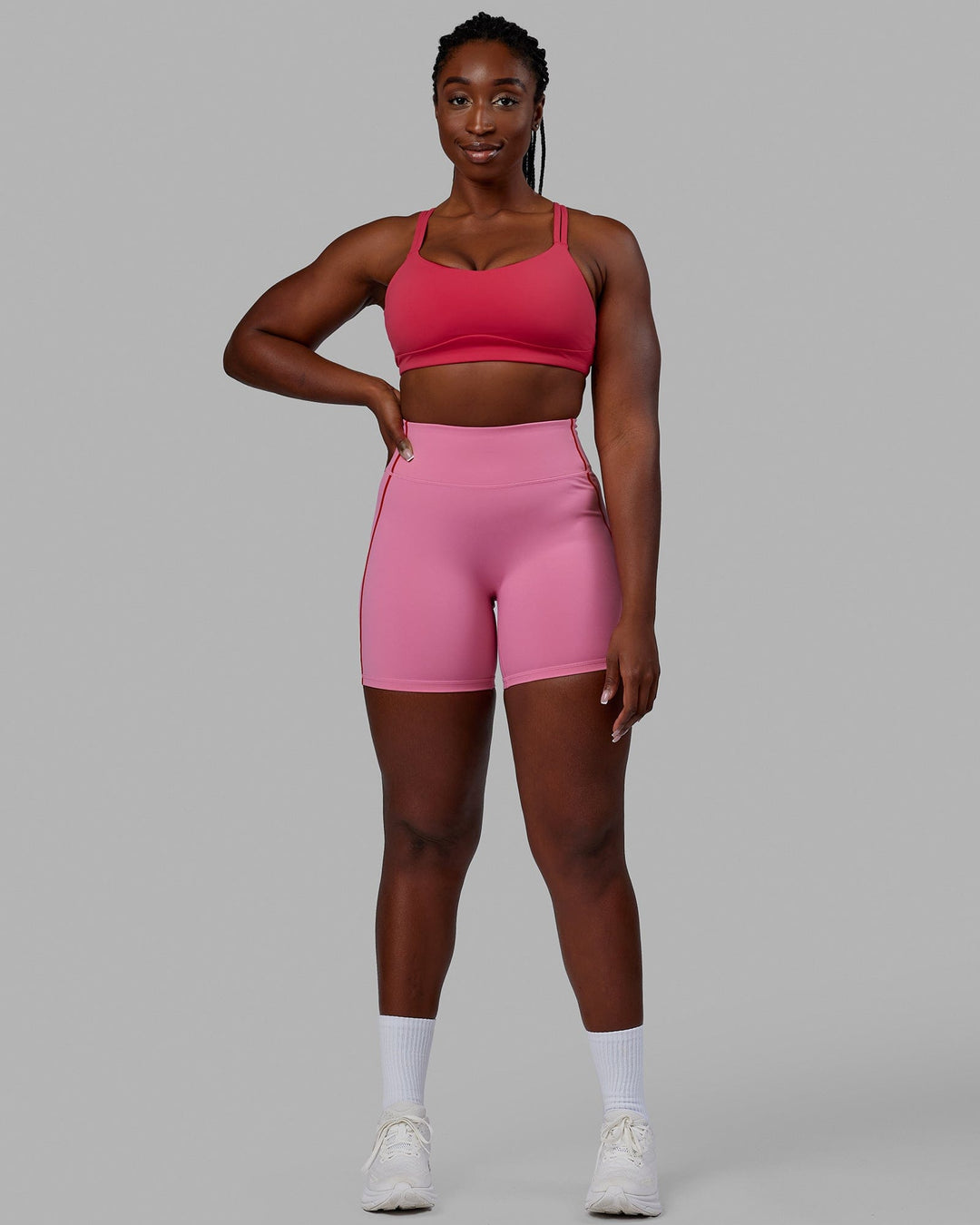 Woman wearing Pulse Mid Short Tights - Pink Rose-Scarlet