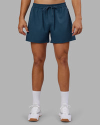 Man wearing Rep 5" Performance Short - Indigo | Model:Jackson | Size:L