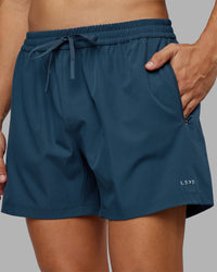 Man wearing Rep 5" Performance Short - Indigo | Model:Jackson | Size:L