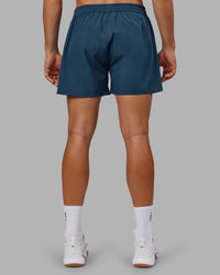 Man wearing Rep 5" Performance Short - Indigo | Model:Jackson | Size:L