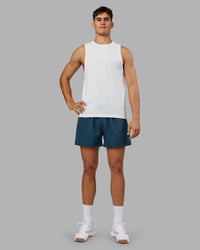 Man wearing Rep 5" Performance Short - Indigo | Model:Jackson | Size:L