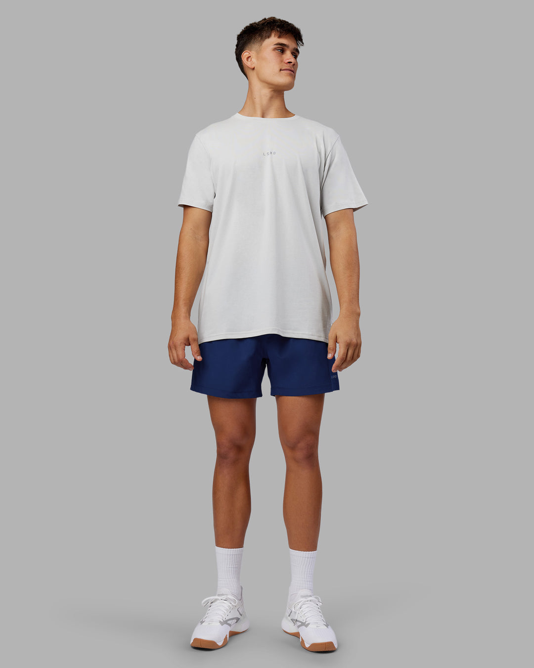 Man wearing Rep 5&quot; Performance Short - Midnight Blue | Model:Jackson | Size:L
