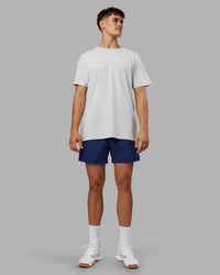 Man wearing Rep 5" Performance Short - Midnight Blue | Model:Jackson | Size:L