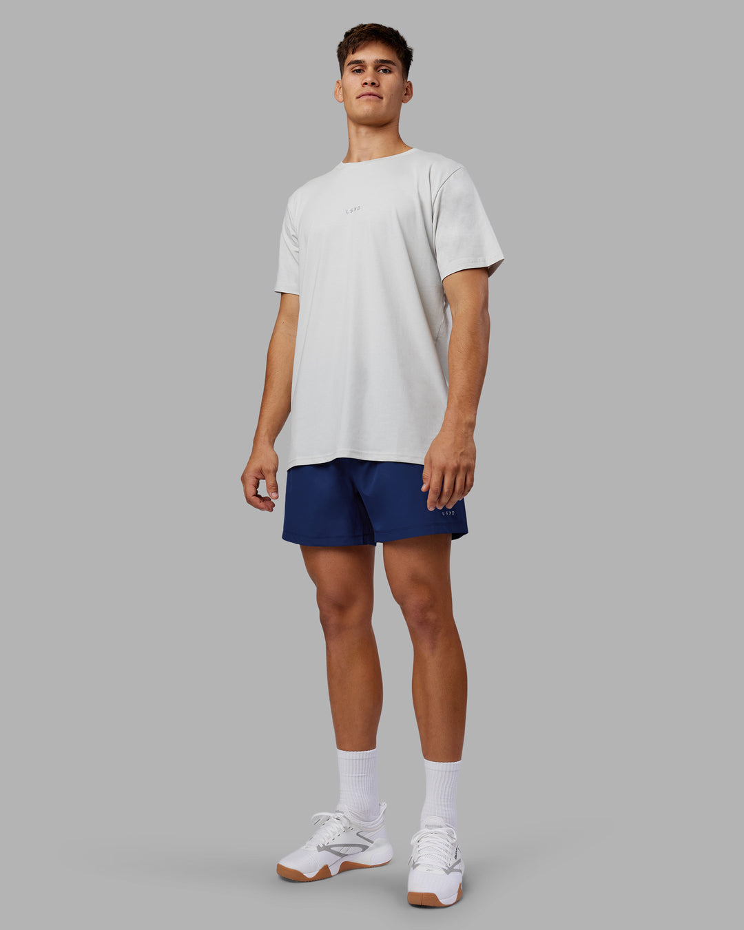 Man wearing Rep 5&quot; Performance Short - Midnight Blue | Model:Jackson | Size:L