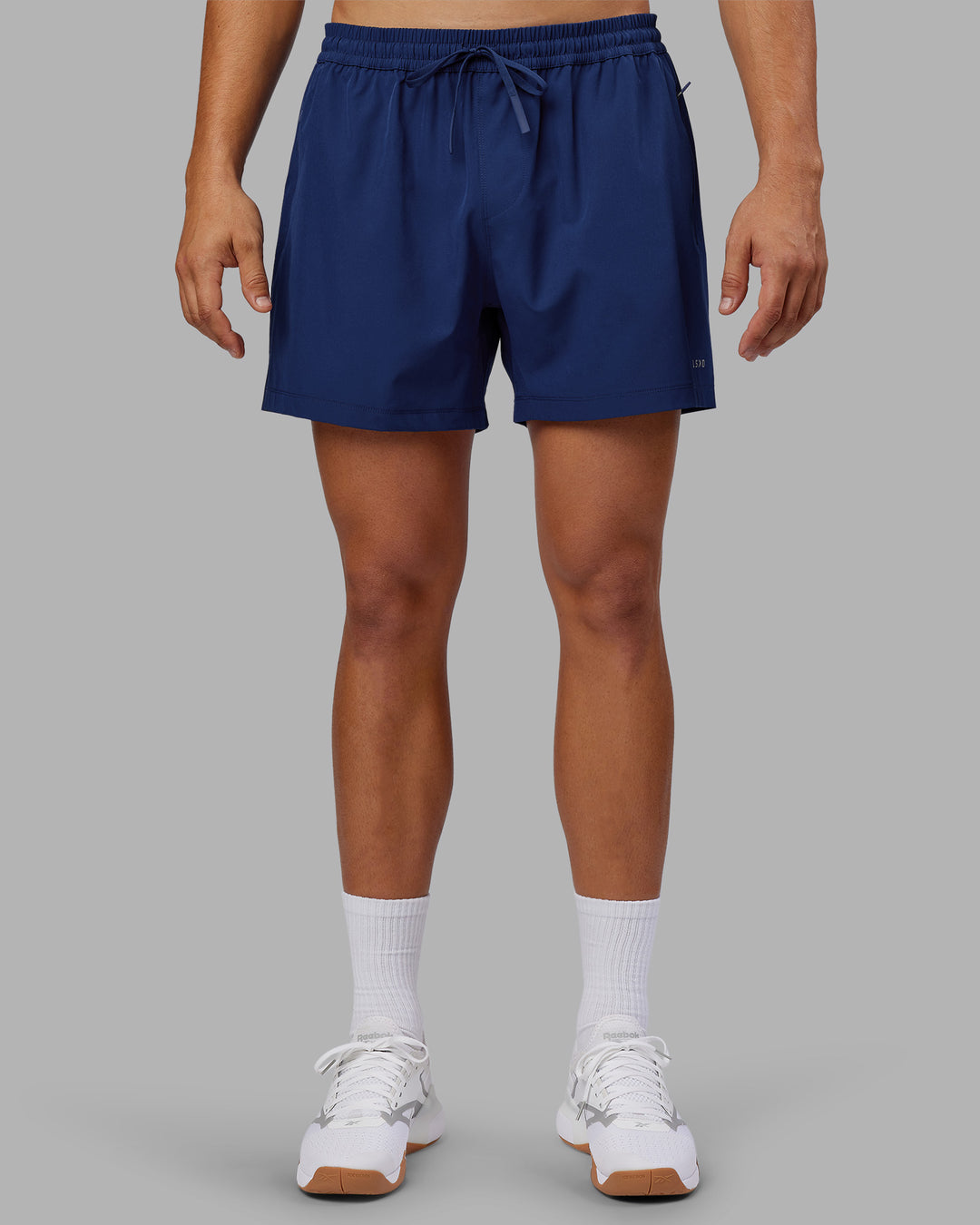 Man wearing Rep 5&quot; Performance Short - Midnight Blue | Model:Jackson | Size:L
