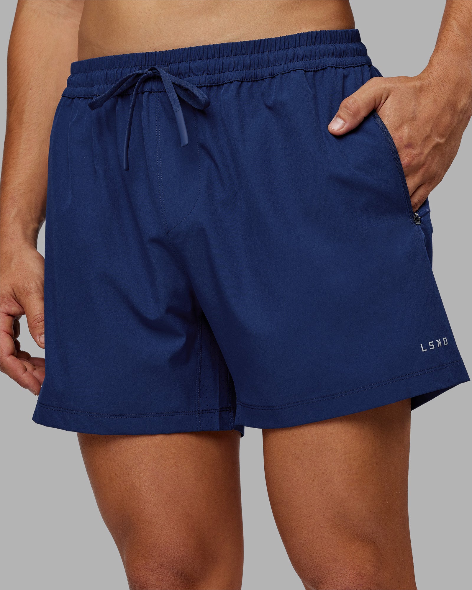 Man wearing Rep 5" Performance Short - Midnight Blue | Model:Jackson | Size:L