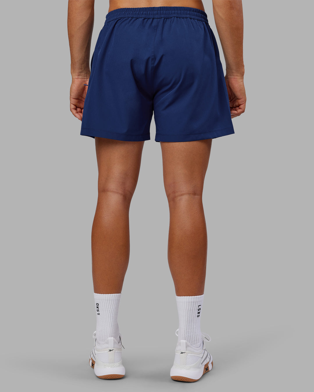 Man wearing Rep 5&quot; Performance Short - Midnight Blue | Model:Jackson | Size:L