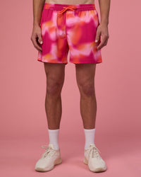 Man wearing Rep 5" Performance Short - Pink Glow Print | Model:Brandon | Size:L