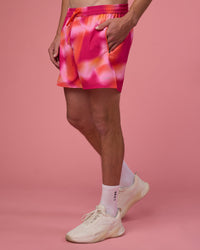 Man wearing Rep 5" Performance Short - Pink Glow Print | Model:Brandon | Size:L