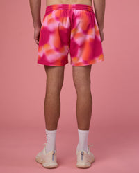Man wearing Rep 5" Performance Short - Pink Glow Print | Model:Brandon | Size:L