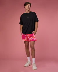 Man wearing Rep 5" Performance Short - Pink Glow Print | Model:Brandon | Size:L