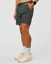 Man wearing Rep 7'' Performance Short - Carbon Green | Model:Liam | Size:L