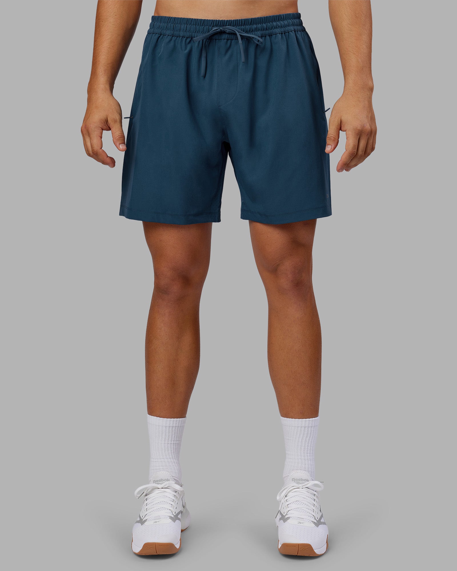 Man wearing Rep 7'' Performance Short - Indigo | Model:Jackson | Size:L
