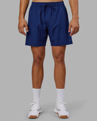 Man wearing Rep 7'' Performance Short - Midnight Blue | Model:Jackson | Size:L