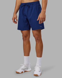 Man wearing Rep 7'' Performance Short - Midnight Blue | Model:Jackson | Size:L