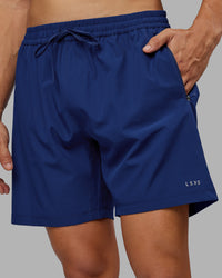 Man wearing Rep 7'' Performance Short - Midnight Blue | Model:Jackson | Size:L