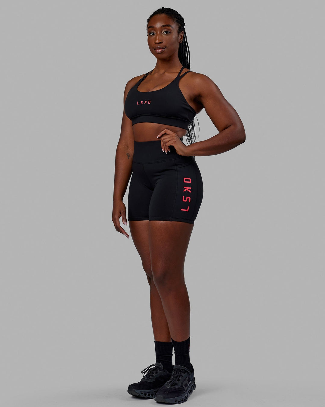Woman wearing Rep Mid Short Tights - Black-Raspberry