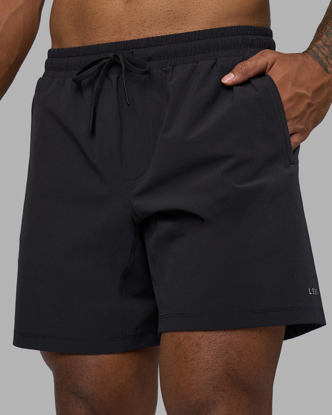 Man wearing Rep TRD Ripstop 7&quot; Training Short - Black | Model:Xav | Size:L