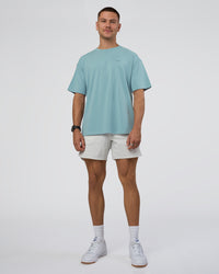 Man wearing Research Department FLXCotton Oversized Tee - Smoke Blue | Model:Nikola | Size:L